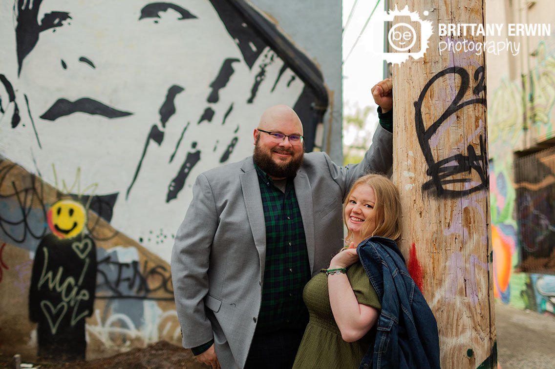Engagement-portrait-photographer-couple-with-grafiti-mural-art.jpg