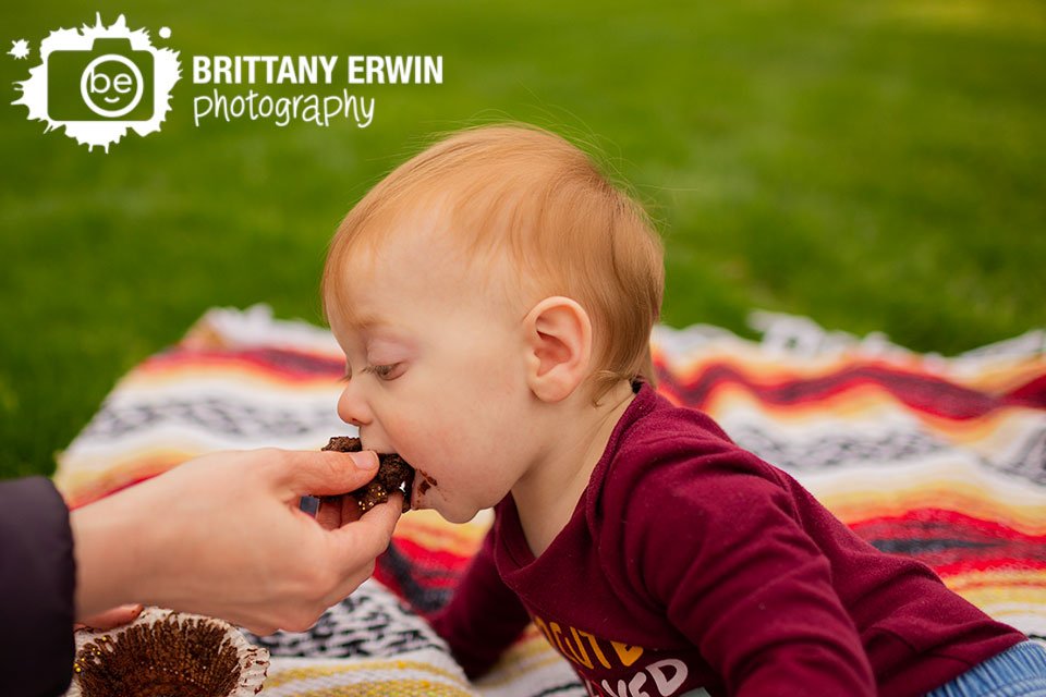 Indianapolis-cake-smash-photographer-boy-with-chocolate-cupcake-outside.jpg