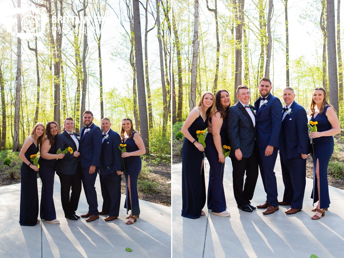 Bride-with-bridal-party-pant-suits-and-navy-dress-with-bowties-and-sunflower.jpg