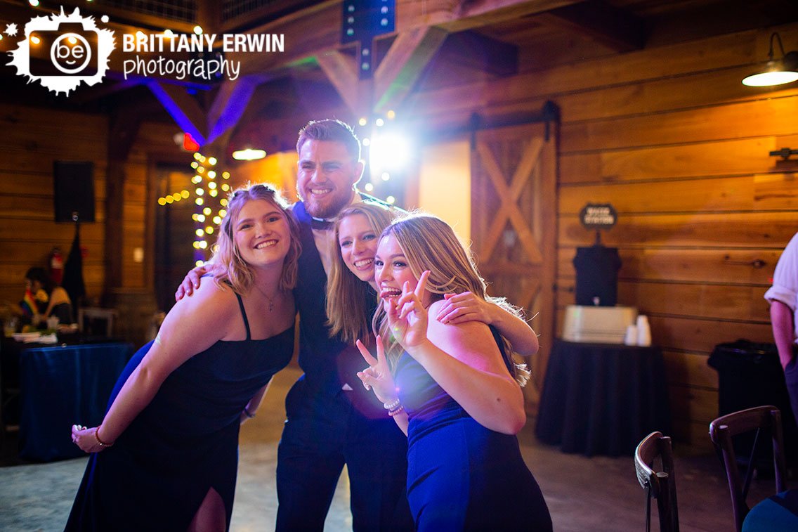 bridal-party-posing-for-portrait-with-backlight-wedding-reception.jpg