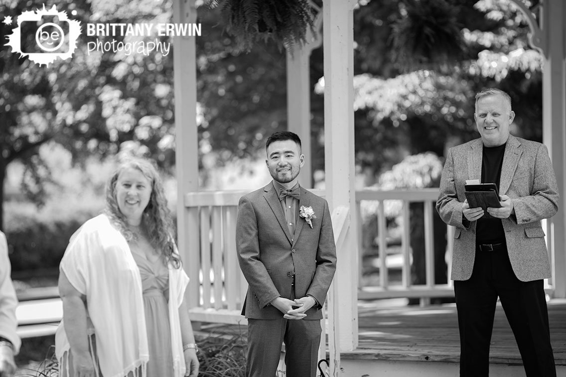 groom-reaction-to-bride-walking-down-aisle-outdoor-ceremony.jpg