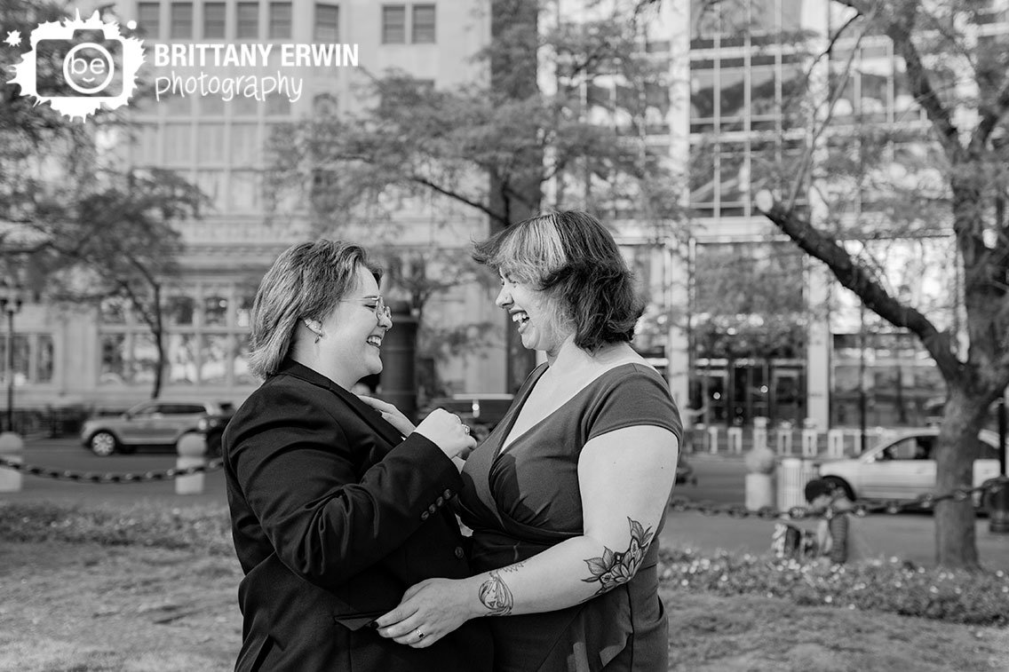 couple-laughing-together-on-monument-circle-downtown-Indianapolis.jpg