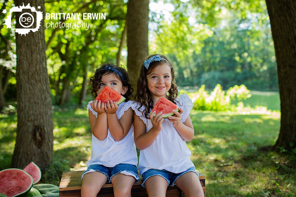 watermelon-mini-session-photographer-sisters-with-fruit-outside.jpg