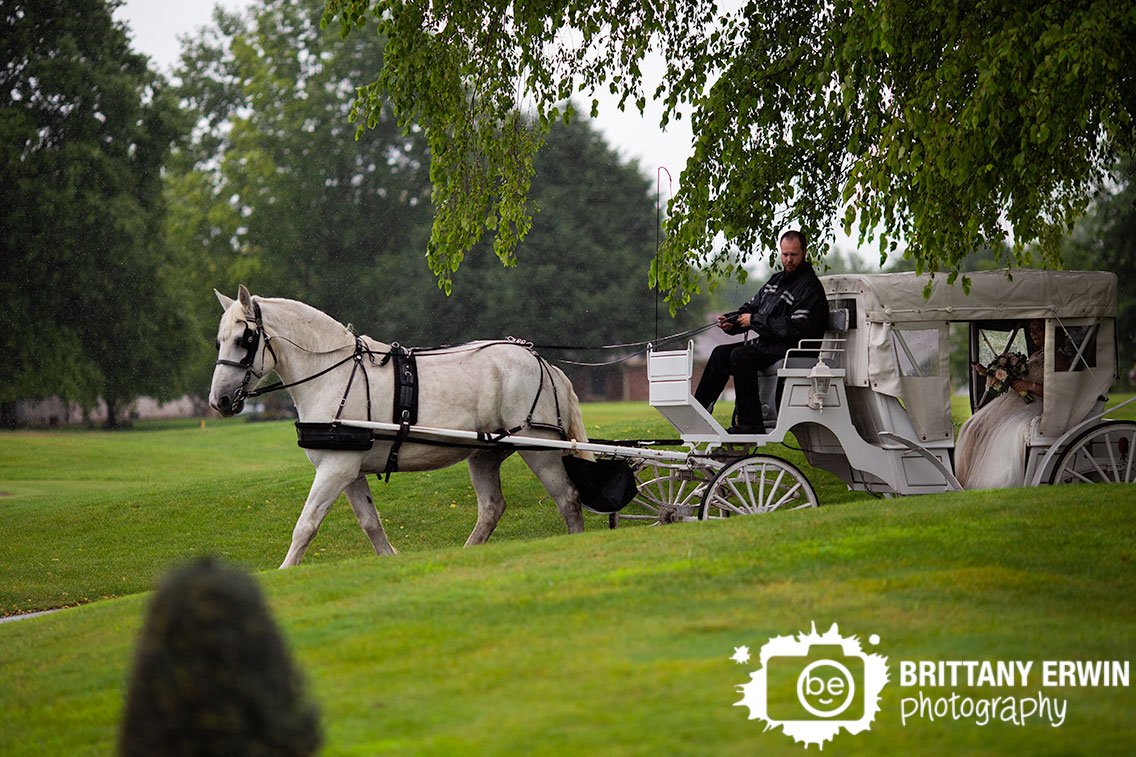 bride-riding-to-ceremony-on-horse-drawn-carriage-Valle-Vista-wedding-photographer.jpg