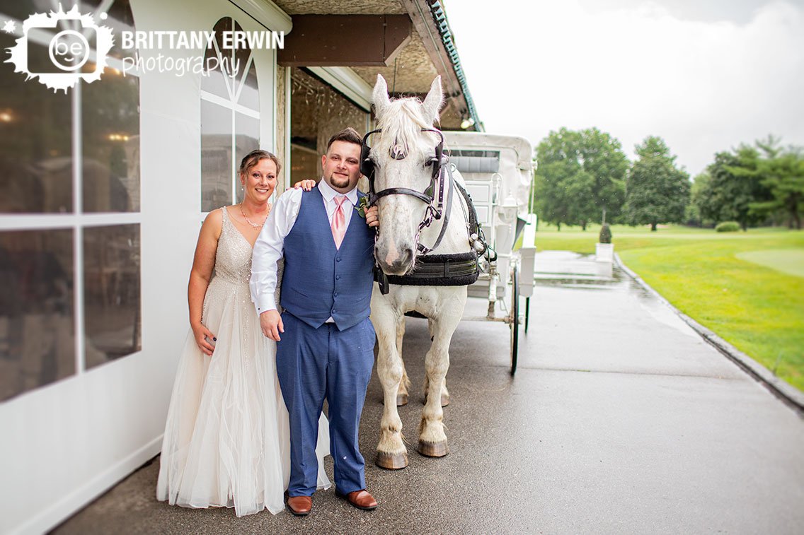 Valle-Vista-Indianapolis-wedding-photographer-bride-groom-outside-with-horse-drawn-carriage.jpg