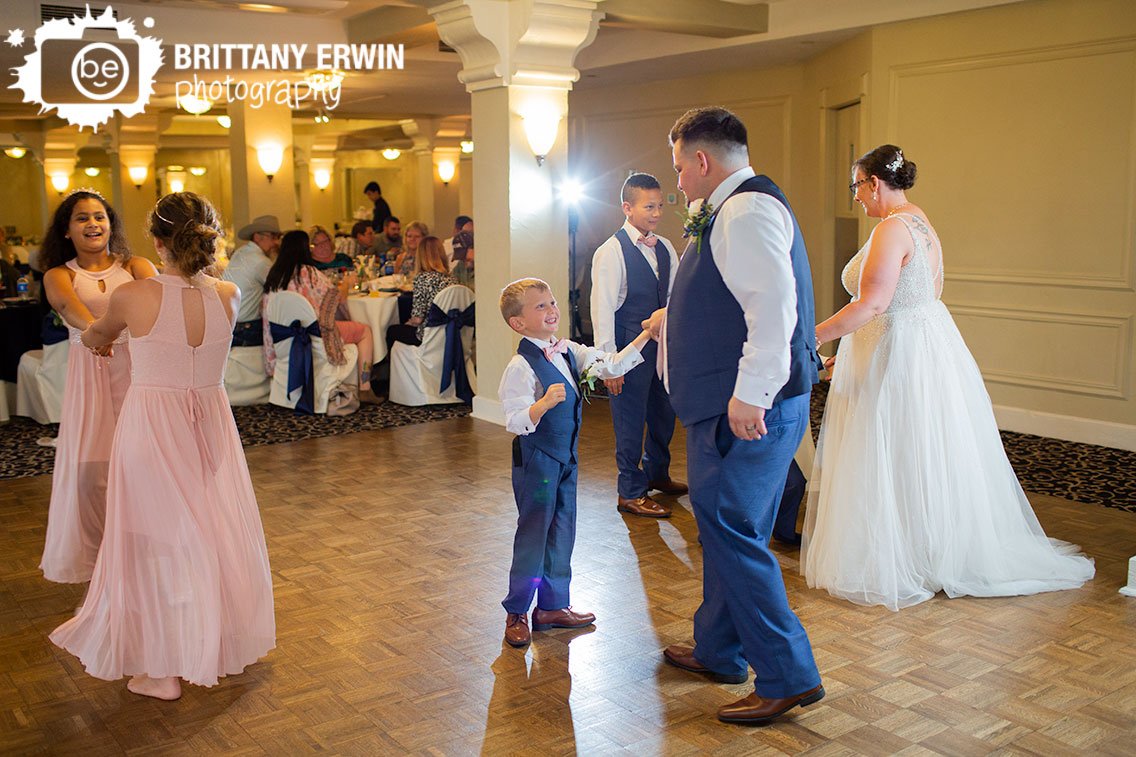 Bride-and-Groom-dancing-with-children-on-wedding-reception-dance-floor.jpg