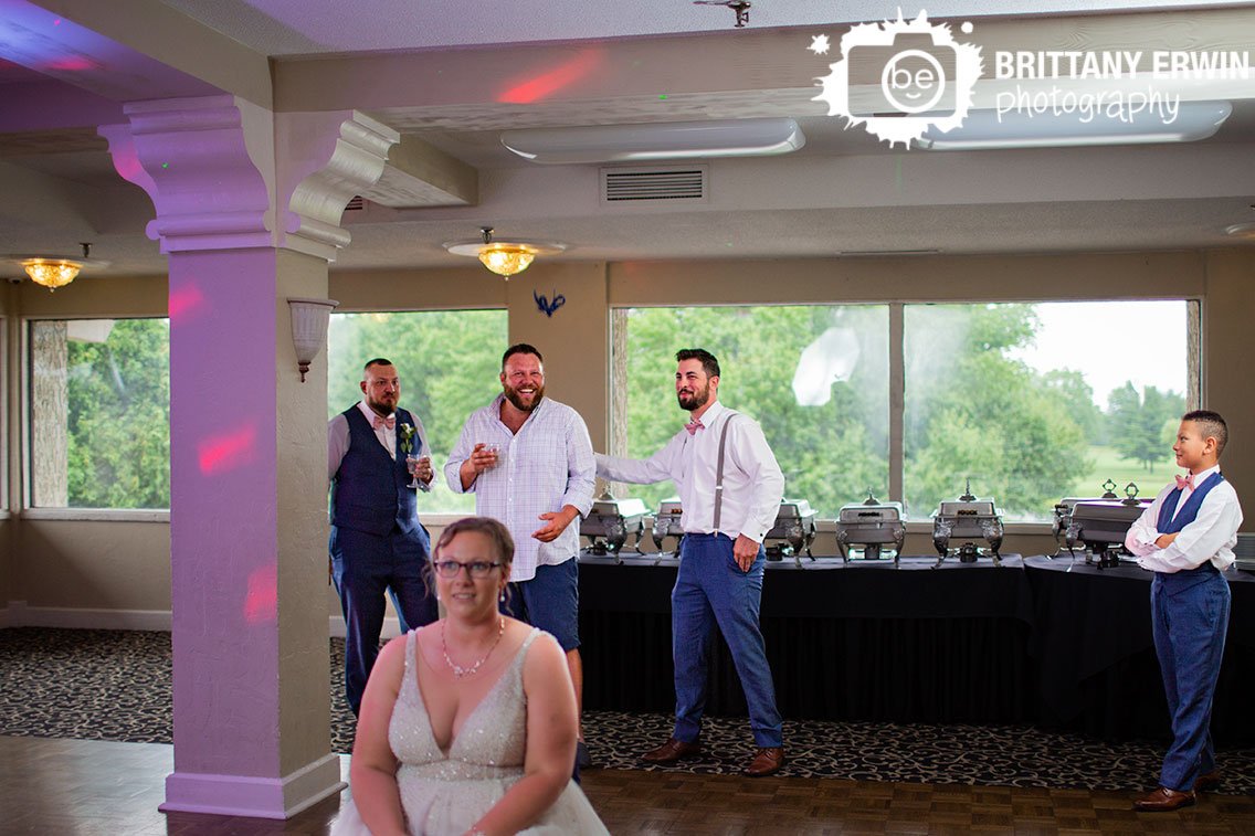 Indianapolis-wedding-garter-toss-guests-catching-laughing.jpg