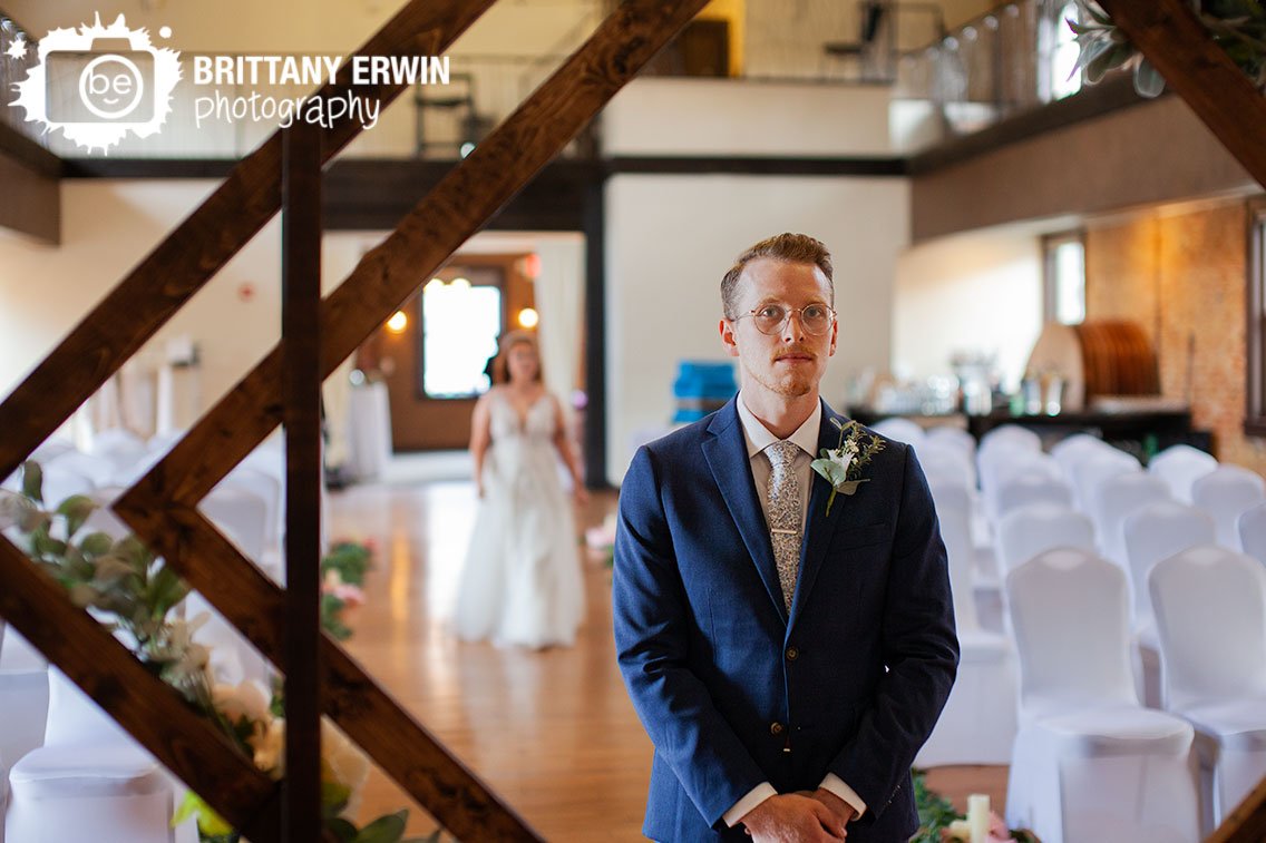 groom-waiting-for-bride-at-altar-for-first-look.jpg