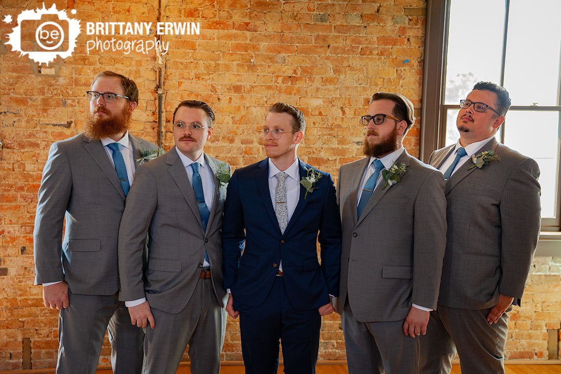 groom-with-groomsmen-brick-wall.jpg