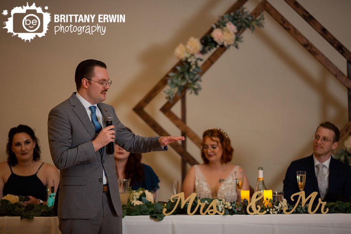 Indianapolis-wedding-photographer-toast-at-wedding-reception-head-table.jpg