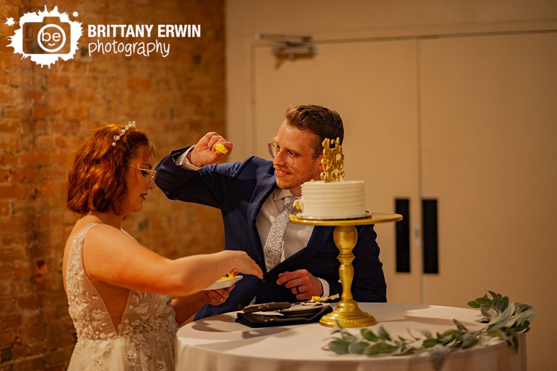 Couple-cutting-cake-at-wedding-reception-funny-groom-and-bride.jpg