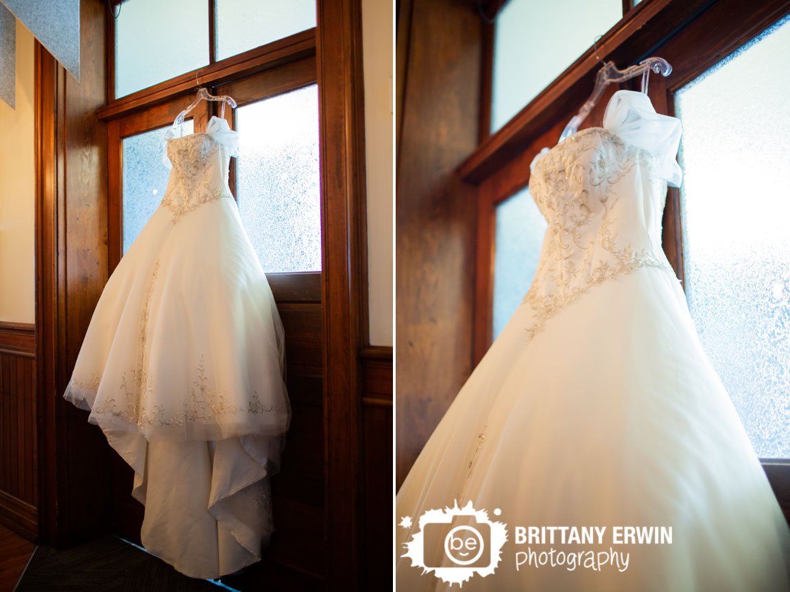 bridal-gown-hanging-from-frosted-glass-wooden-door.jpg