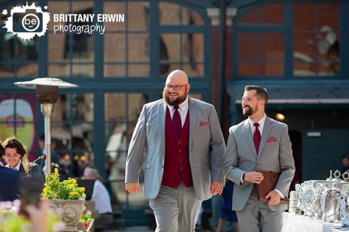 Indianapolis-wedding-venue-Rathskeller-Biergarten-groom-walking-with-officiant.jpg