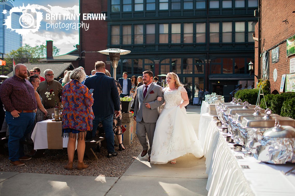 Bride-and-brother-walking-down-aisle-Rathskeller-biergarten-outdoor-ceremony.jpg