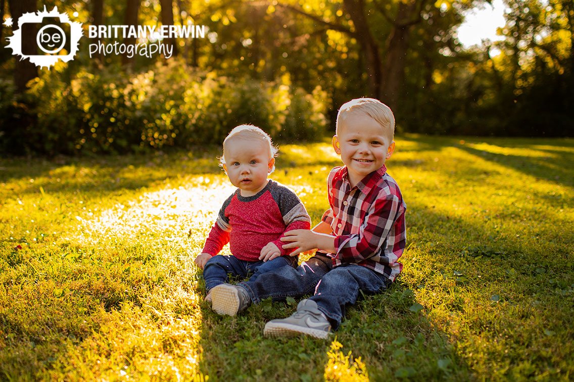 Indianapolis-portrait-photographer-brothers-in-grass-fall-sunset.jpg