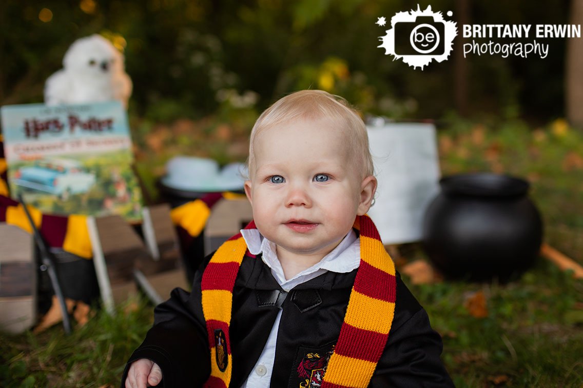 Harry-Potter-theme-birthday-portrait-baby-boy-in-wizard-robe-and-striped-scarf.jpg