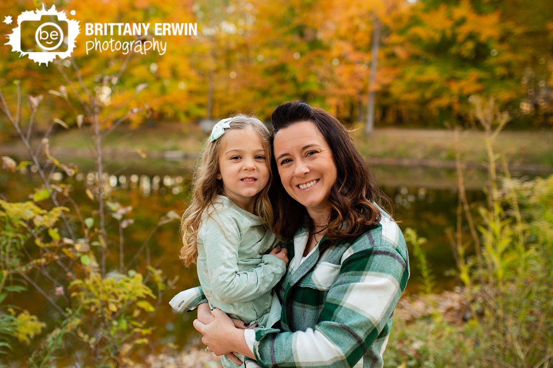 mother-daughter-on-path-next-to-lake-fall-portrait.jpg