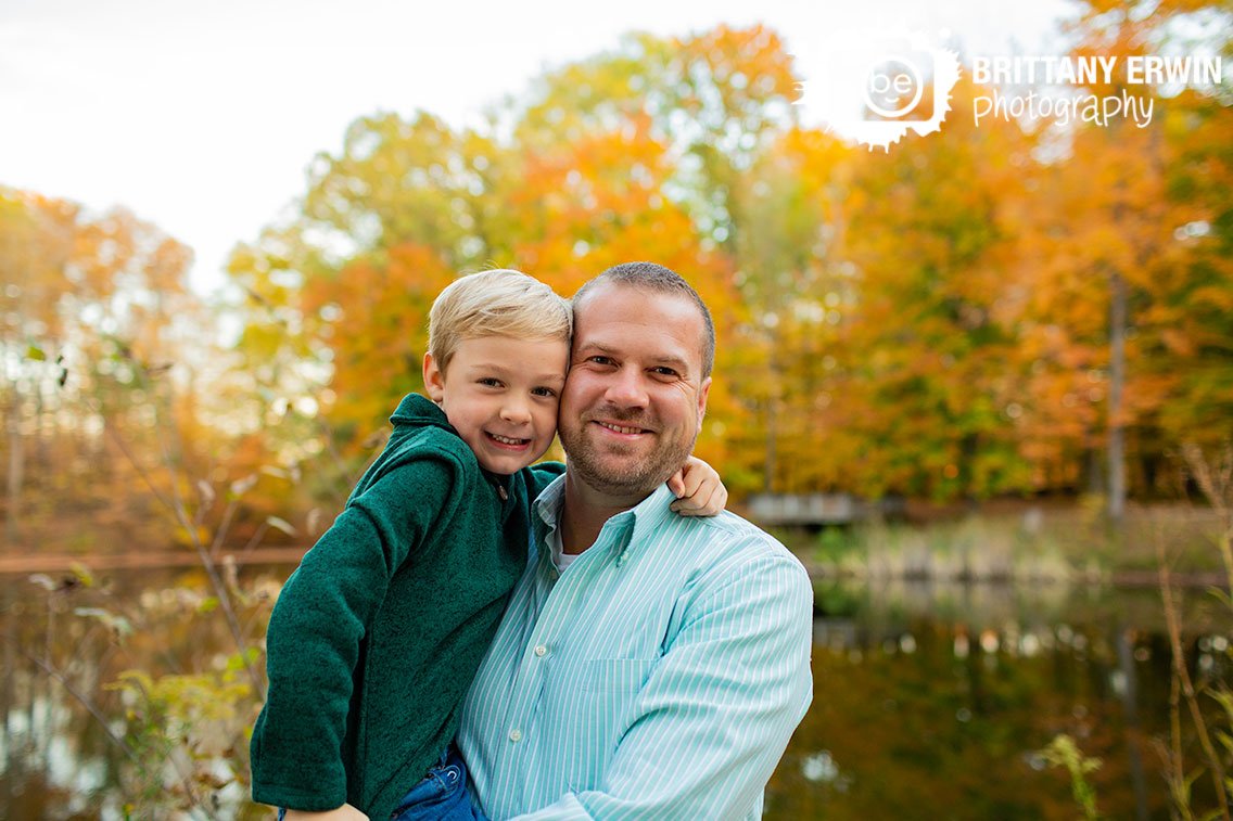 father-son-outdoor-fall-portrait-with-lake-in-background.jpg