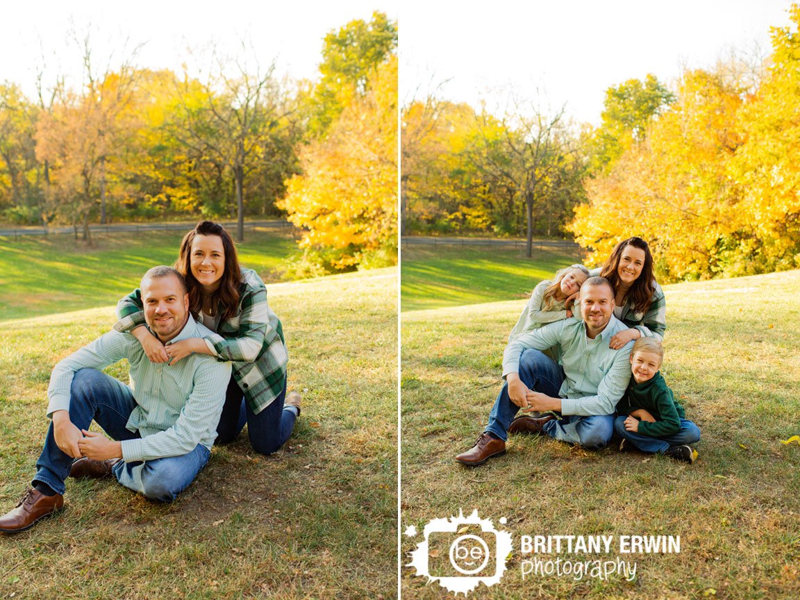 Family-portrait-photographer-on-hill-with-yellow-trees-fall-outdoor.jpg