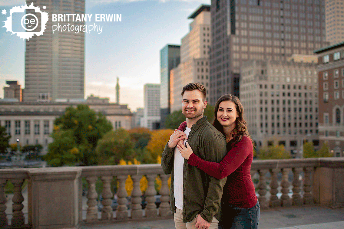 Downtown-Indianapolis-engagement-portrait-photographer-couple-on-landing-overlooking-buildings.gif
