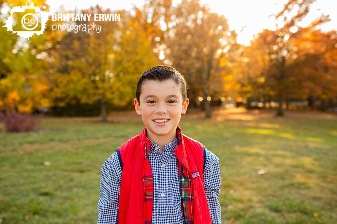 Indianapolis-portrait-photographer-boy-with-red-vest-fall-leaves.jpg