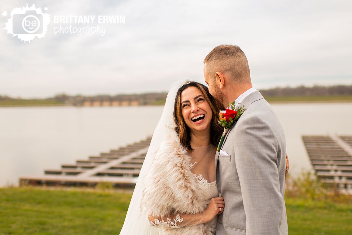 Indianapolis-wedding-photographer-bridal-portrait-by-lake-marina-bride-laughing-with-groom.jpg