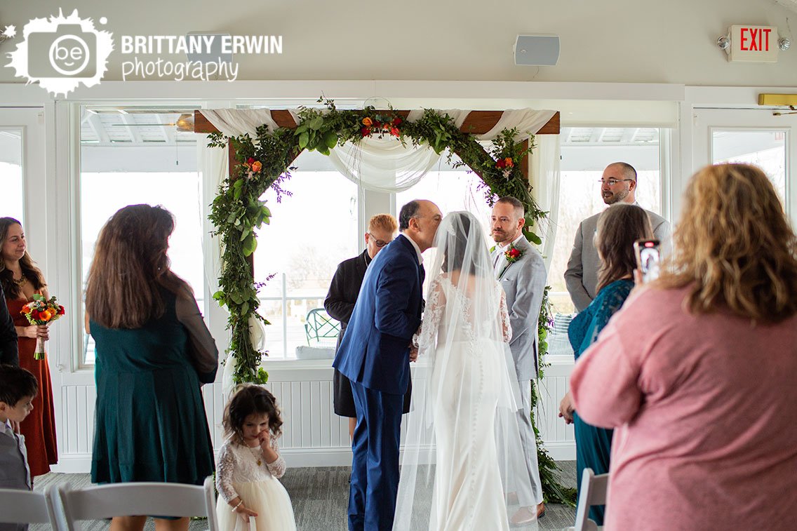 father-of-bride-forehead-kiss-Indoor-wedding-ceremony.jpg