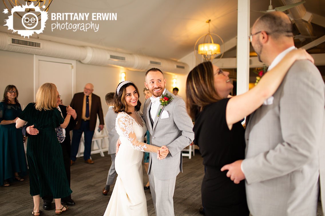 bride-and-groom-dancing-on-dance-floor-with-guests-Ricks-Cafe-Boatyard.jpg