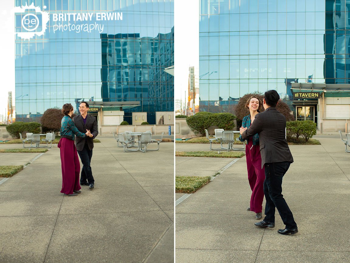 downtown-Indianapolis-engagement-portrait-photographer-couple-swing-dancing-outside-jw-mariott.jpg