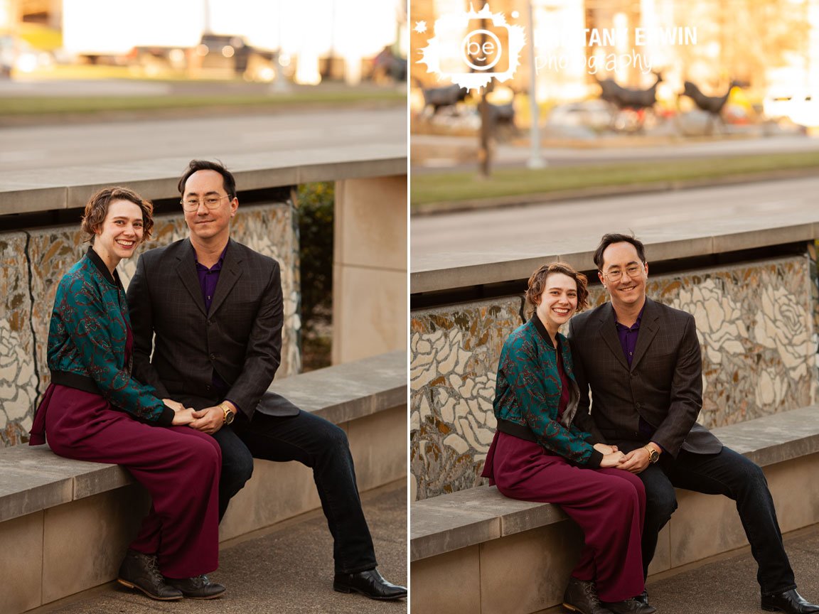 Engagment-portrait-couple-on-ledge-with-rose-mosaic-and-deer-fountain-downtown-Indianapolis.jpg
