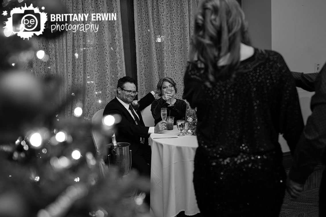 Couple-toast-at-wedding-reception-holding-up-glass.jpg