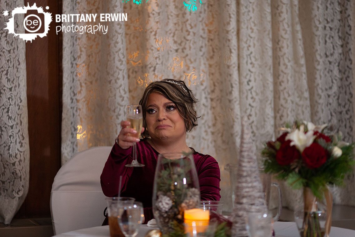 emotional-tearful-toast-bride-at-head-table-with-toasting-flute.jpg