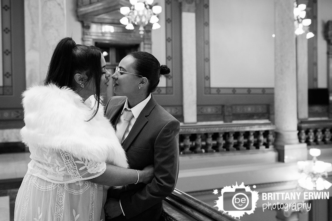 Indianapolis-wedding-photographer-couple-at-railing-inside-state-house-Indy.jpg