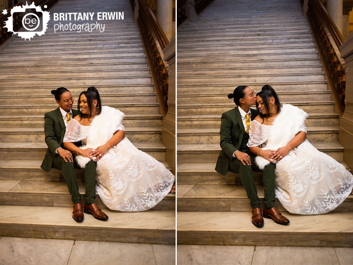 Indianapolis-indoor-wedding-venue-couple-on-marble-staircase-lace-gown-green-suit-with-yellow-tie.jpg