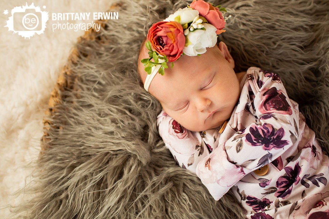 Indianapolis-in-home-newborn-portrait-photographer-sleeping-girl-flower-headband-and-floral-onesie.jpg