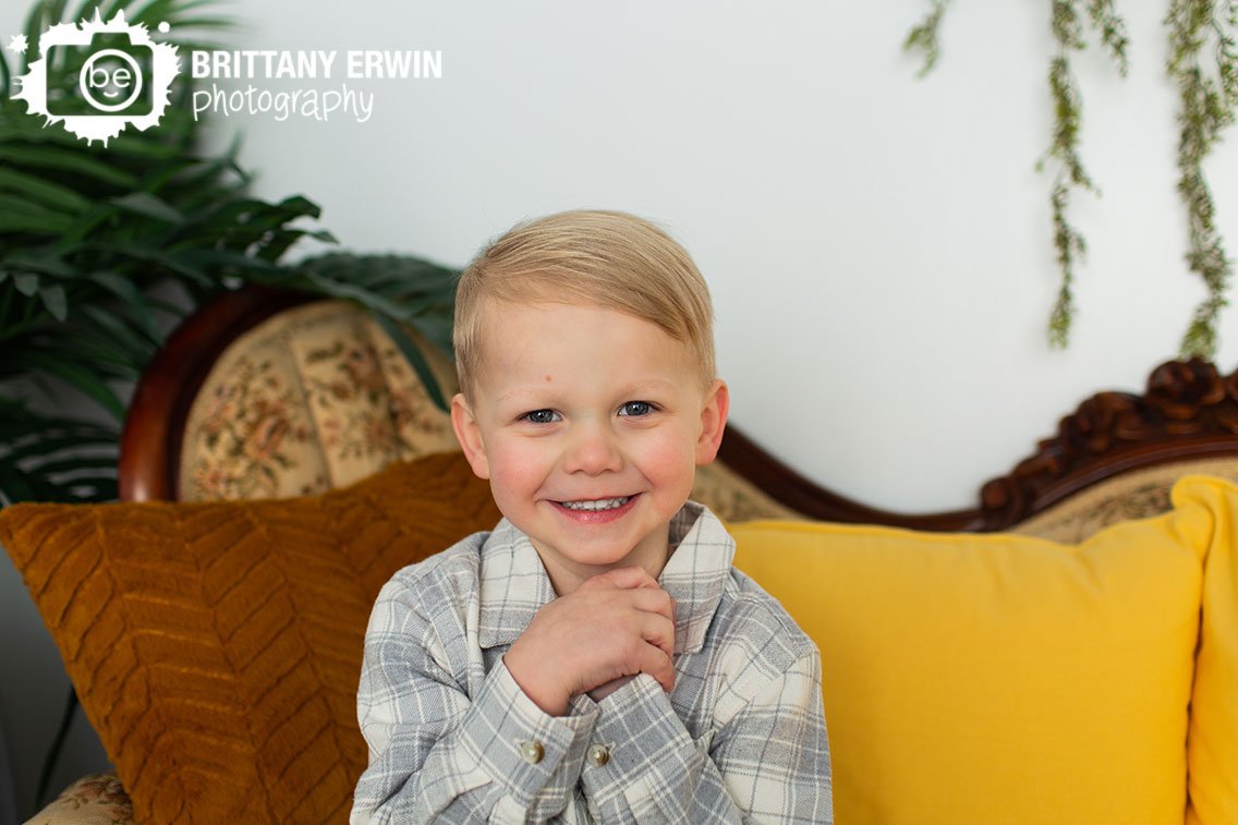 Indianapolis-portrait-photographer-boy-on-yellow-spring-couch.jpg