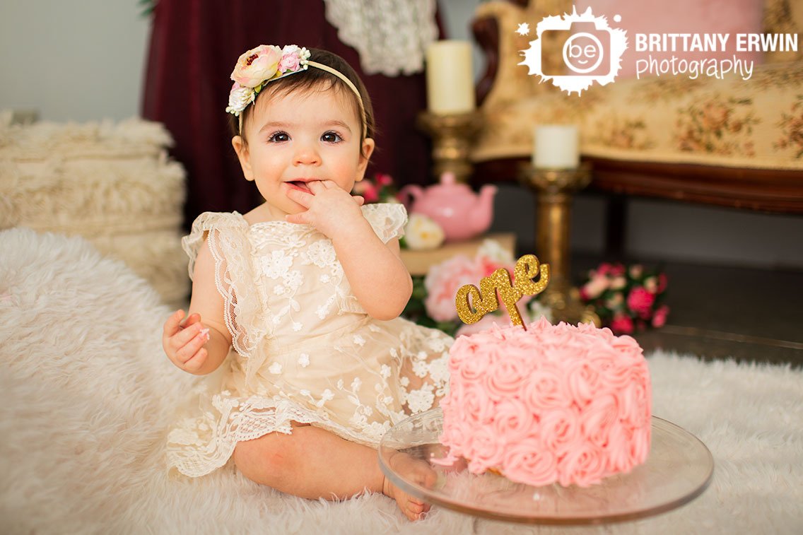 Indianapolis-portrait-photographer-first-birthday-baby-girl-with-pink-cake.jpg