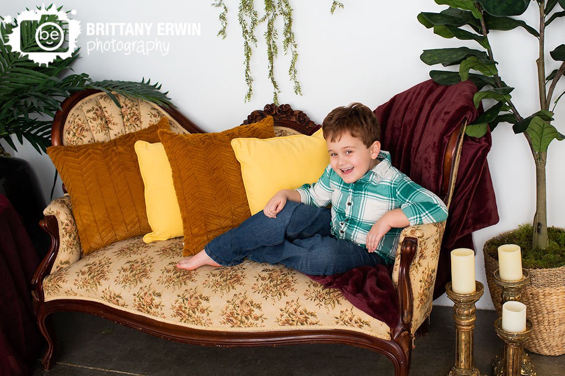 Silly-boy-on-antique-couch-portrait.jpg