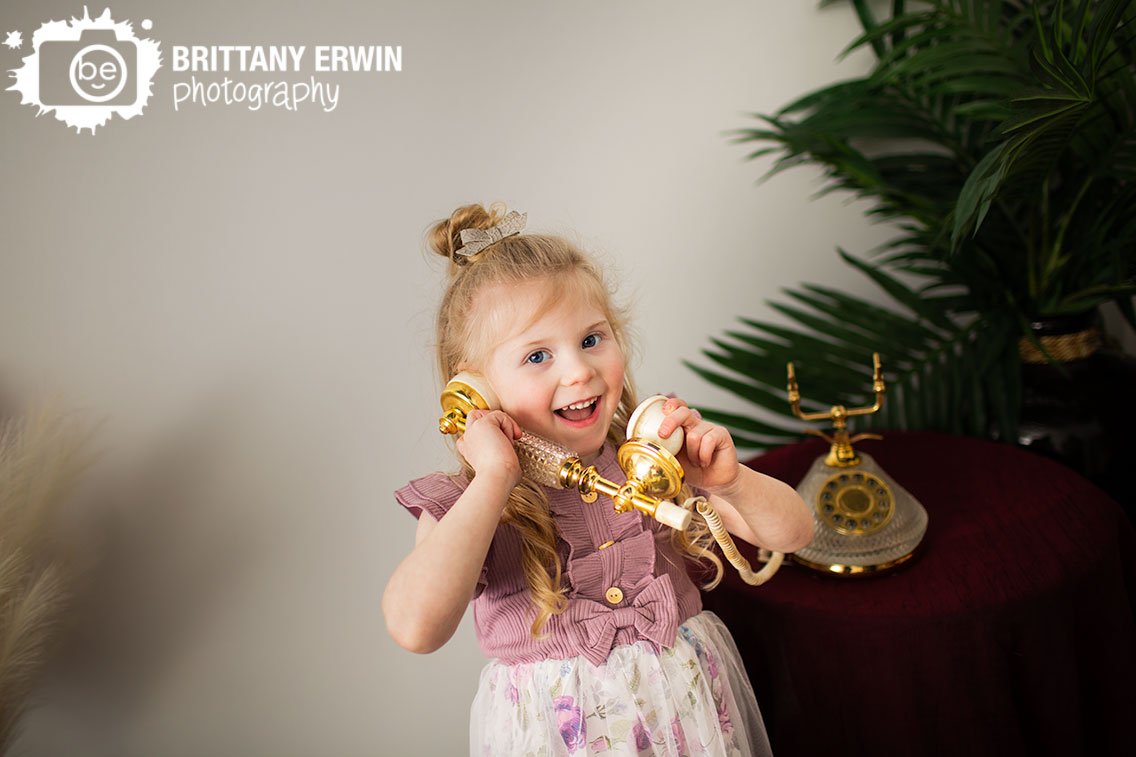 Indianapolis-portrait-photographer-girl-on-antique-telephone-silly.jpg