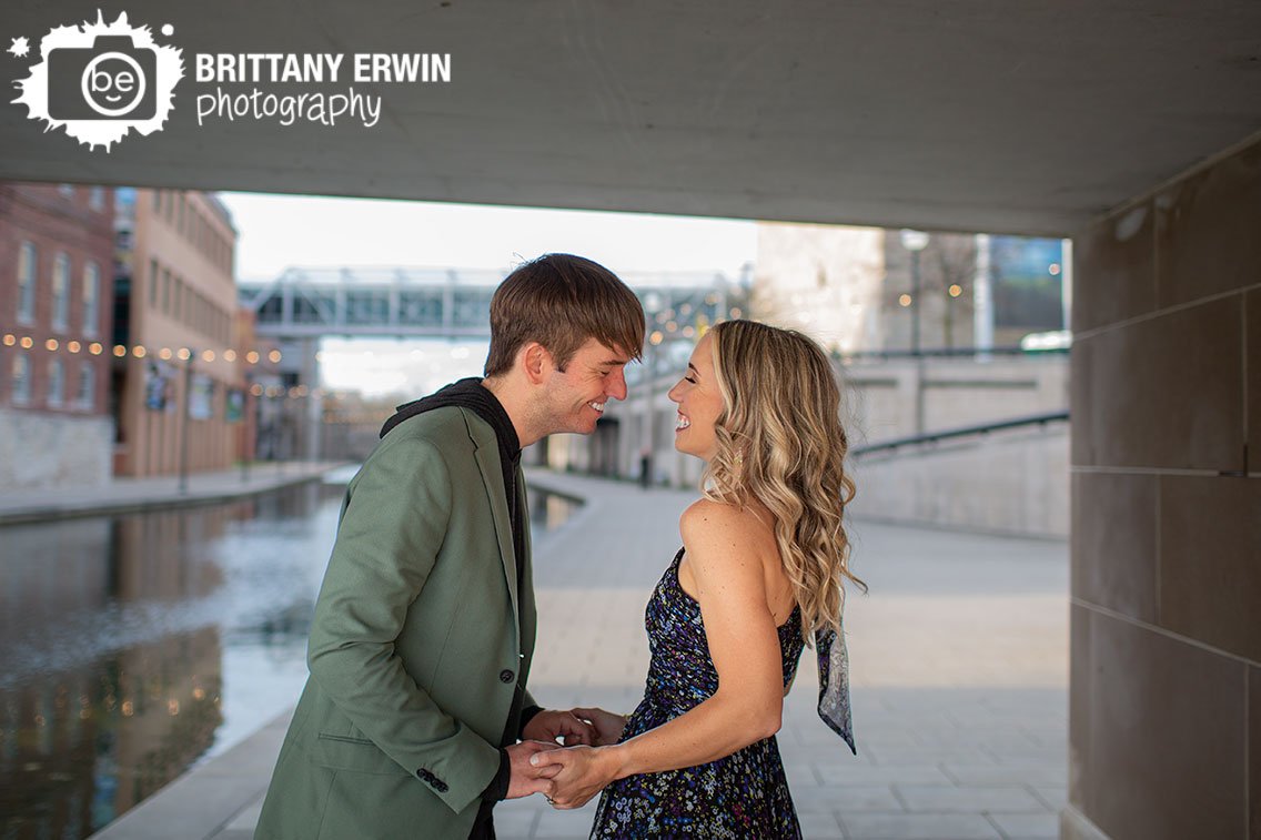 Indianapolis-canal-engagement-portrait-photographer-couple-under-bridge-by-water.jpg