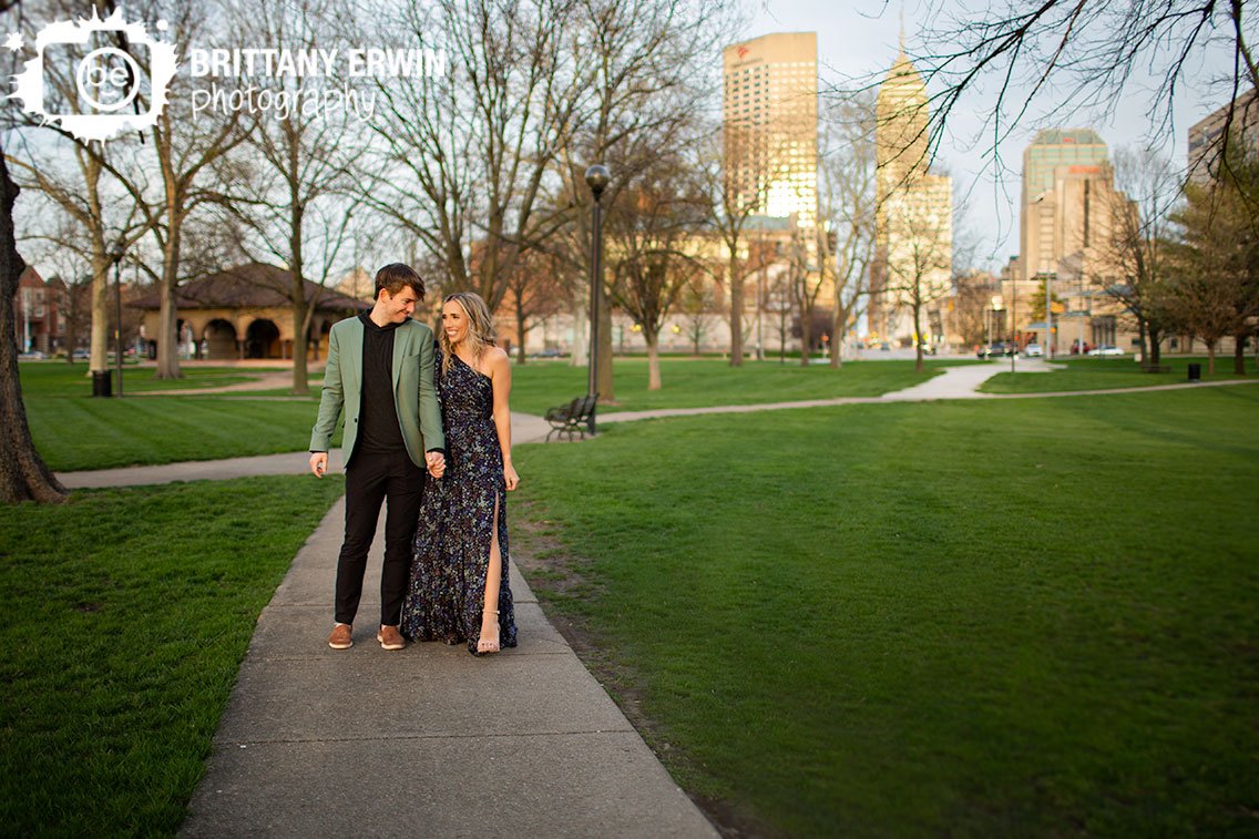 Downtown-Indianapolis-engagement-portrait-photographer-couple-walking-in-military-park.jpg