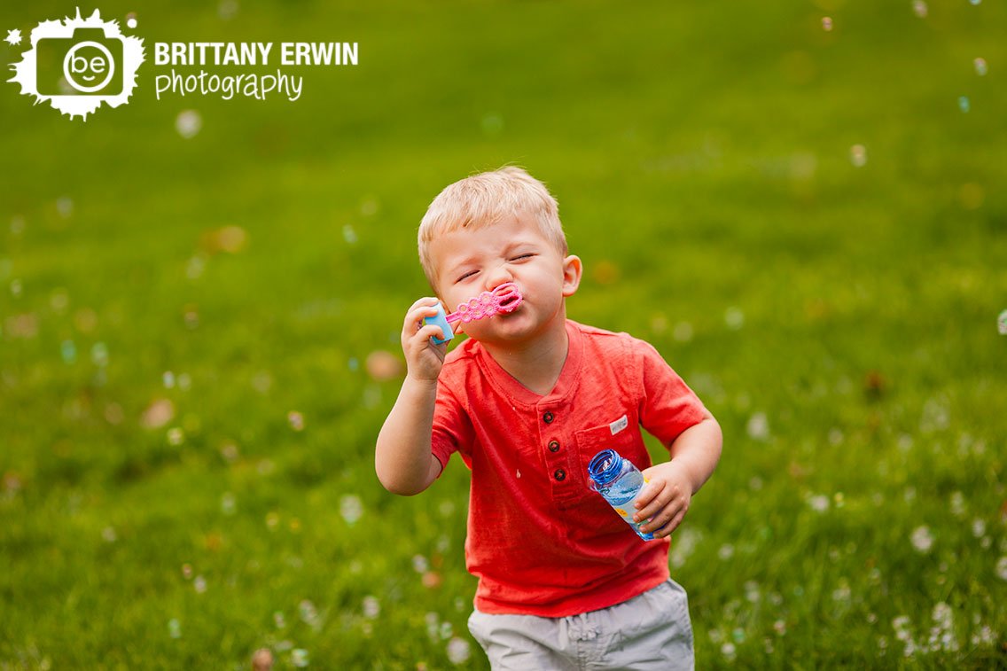 Indianapolis-boy-playing-outside-with-bubbles-silly-face.jpg