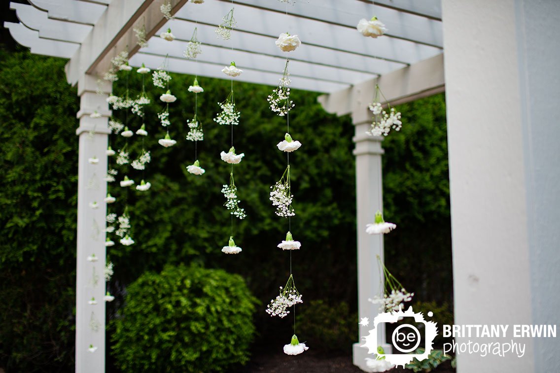 flower-hanging-on-altar-outdoor-wedding-ceremony.jpg