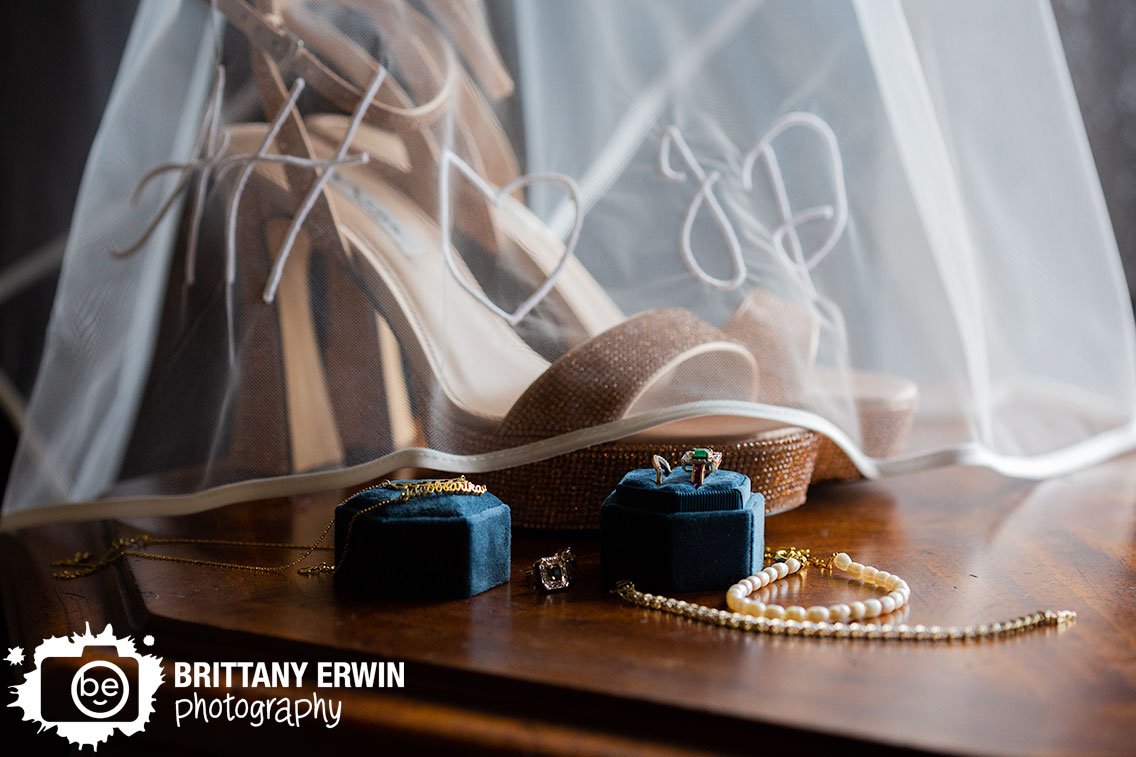 Fountain-square-Theatre-wedding-photographer-embroidered-veil-over-sparkle-shoes-velvet-ring-box.jpg