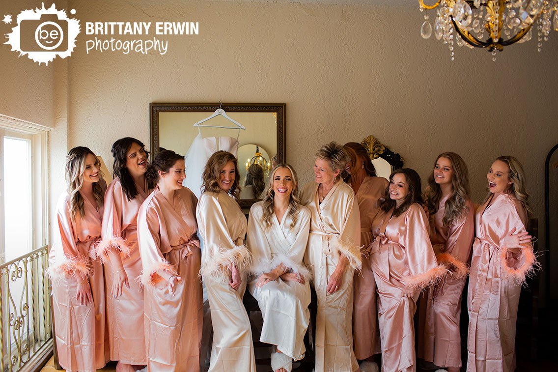 Fountain-Square-Theatre-wedding-photographer-bride-with-bridesmaids-in-feather-cuffed-robes.jpg