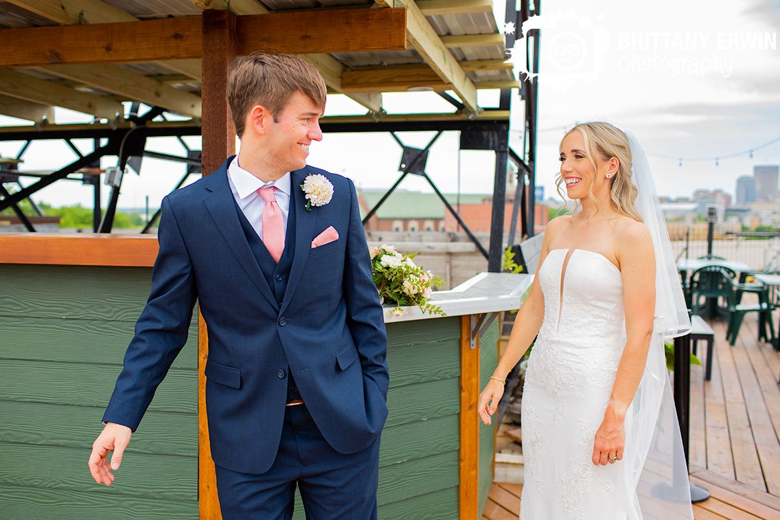 Fountain-Square-Theatre-rooftop-lounge-first-look-groom-turning-around.jpg