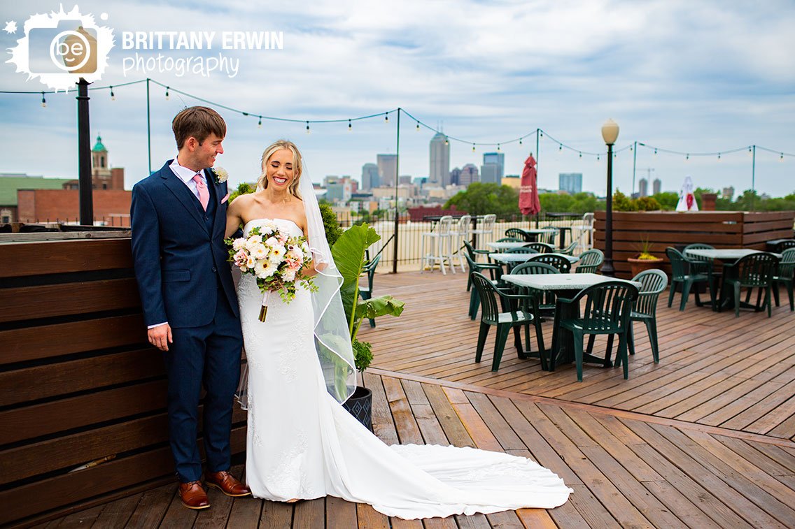 Indianapolis-wedding-portrait-photographer-couple-on-roof-with-skyline.jpg