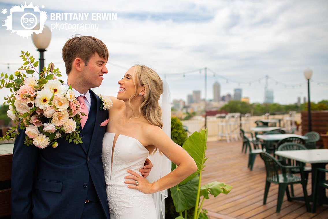 couple-silly-face-outdoor-wedding-portrait-photographer-Fountain-Square.jpg