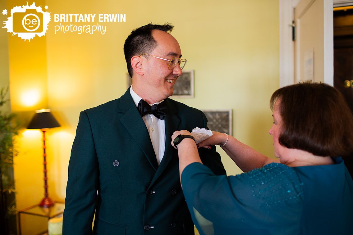 Groom-getting-ready-mother-helping-with-custom-pocket-square.jpg