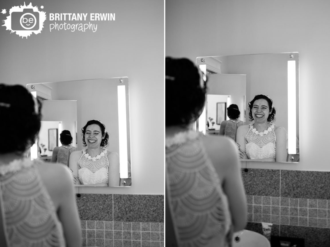 Wedding-photographer-bride-getting-ready-in-lighted-mirror.jpg